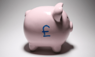 Piggy Bank With Uk Currency Sign Symbolizing Uk Money Savers