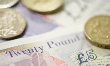 UK Currency Symbolizing Young Caregivers Eligible for £383 Annual Payment