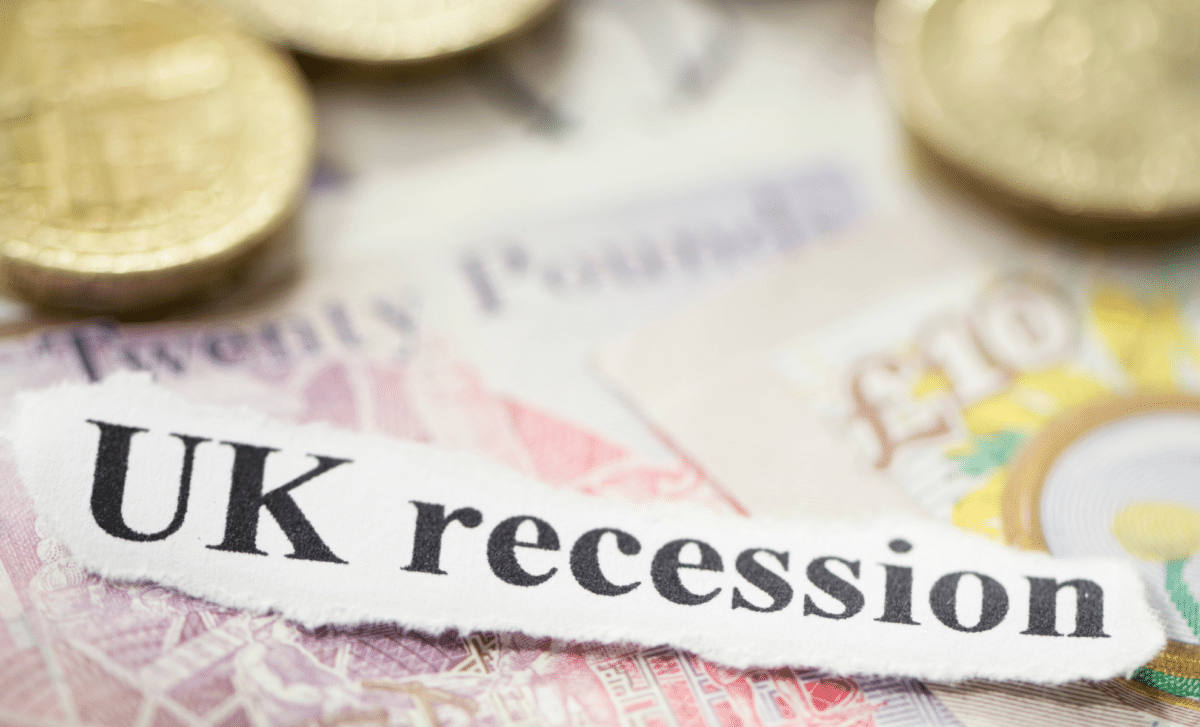 Torn Out Text "UK Recession" and UK Currency