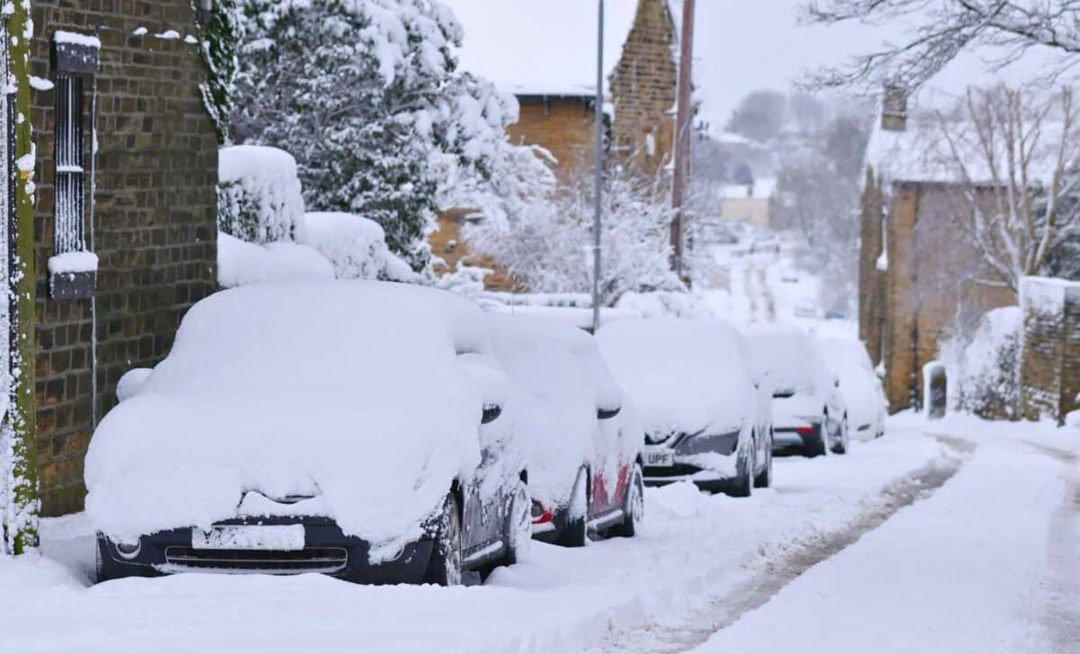 Weather : Snow Covered Cars Parked Outside.