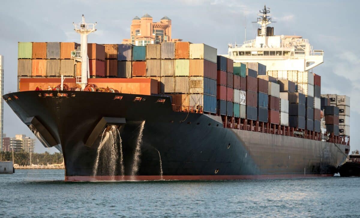 Large Trade Ship Carrying A Container Ship On Top Of It