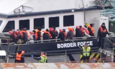 Migrants Getting off Small Migrant Boat