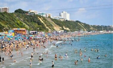 People On A Beach In The Uk In Hot Weather