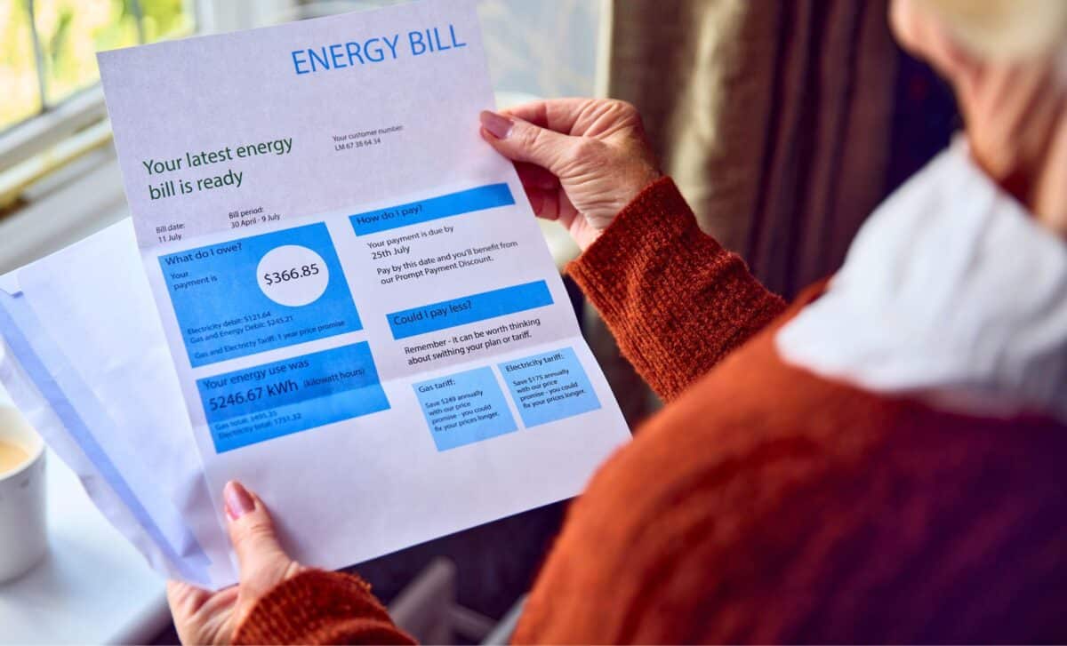 Senior Woman Opening UK Energy Bills