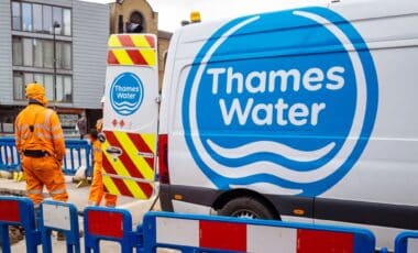 Thames Water Workers Standing Besides Thames Water Van