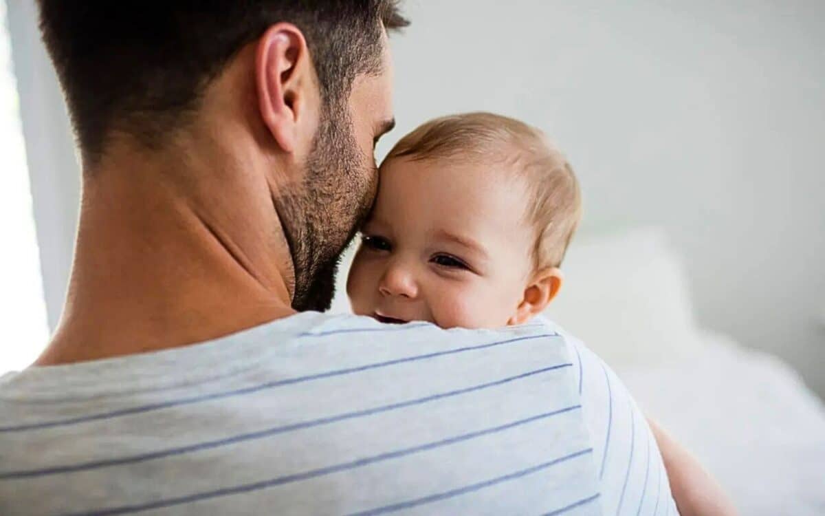 Paternity Leave - A Father Hugging His Baby