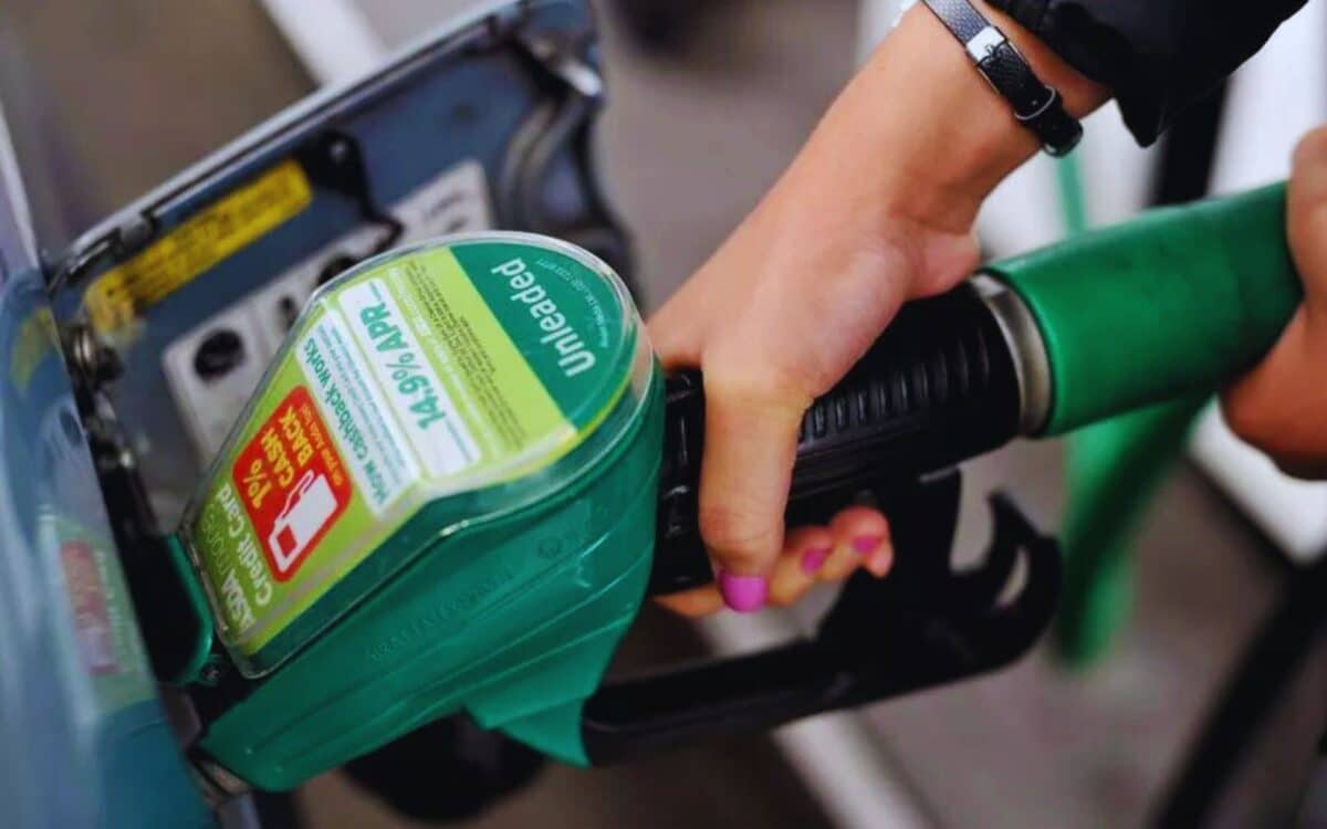 A Women Pumping Fuel To Her Car