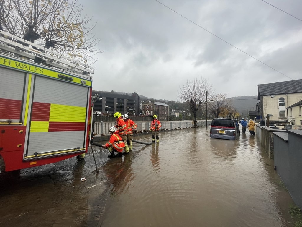 Firefighters Pump Water From A Street In Pontypridd