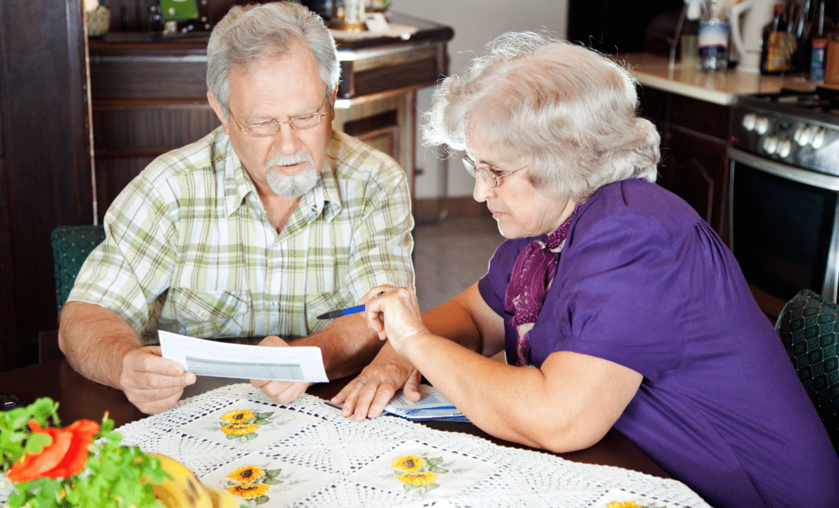 State Pensioners With Files In Their Hands