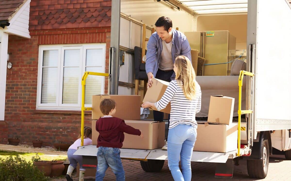 A family Moving Into Or Out Of A Home.