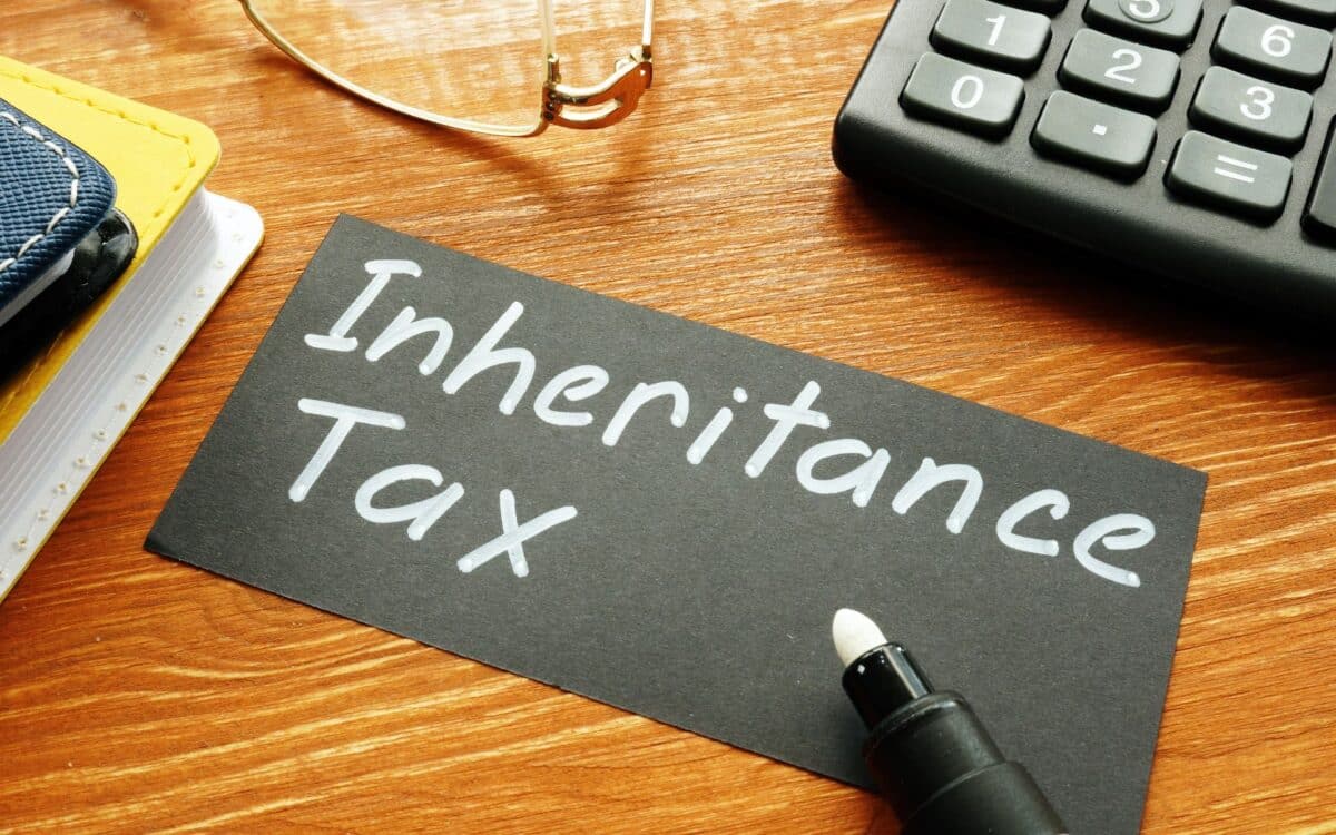 Black Card With The Words Inheritance Tax Written In White Marker