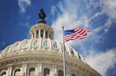 Jobs-United States Capitol building, topped by the Statue of Freedom, with an American flag