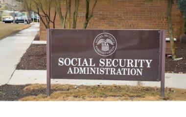 A sign for the Social Security Administration in front of a building