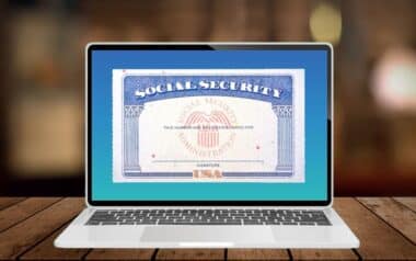 A laptop displaying a Social Security card