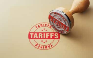 A red stamp with the word "TARIFFS"