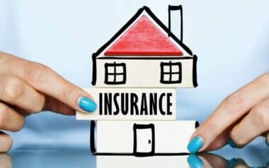 A block with the word Insurance onto a drawing of a house