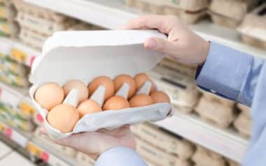Person Buying Eggs in the Supermarket