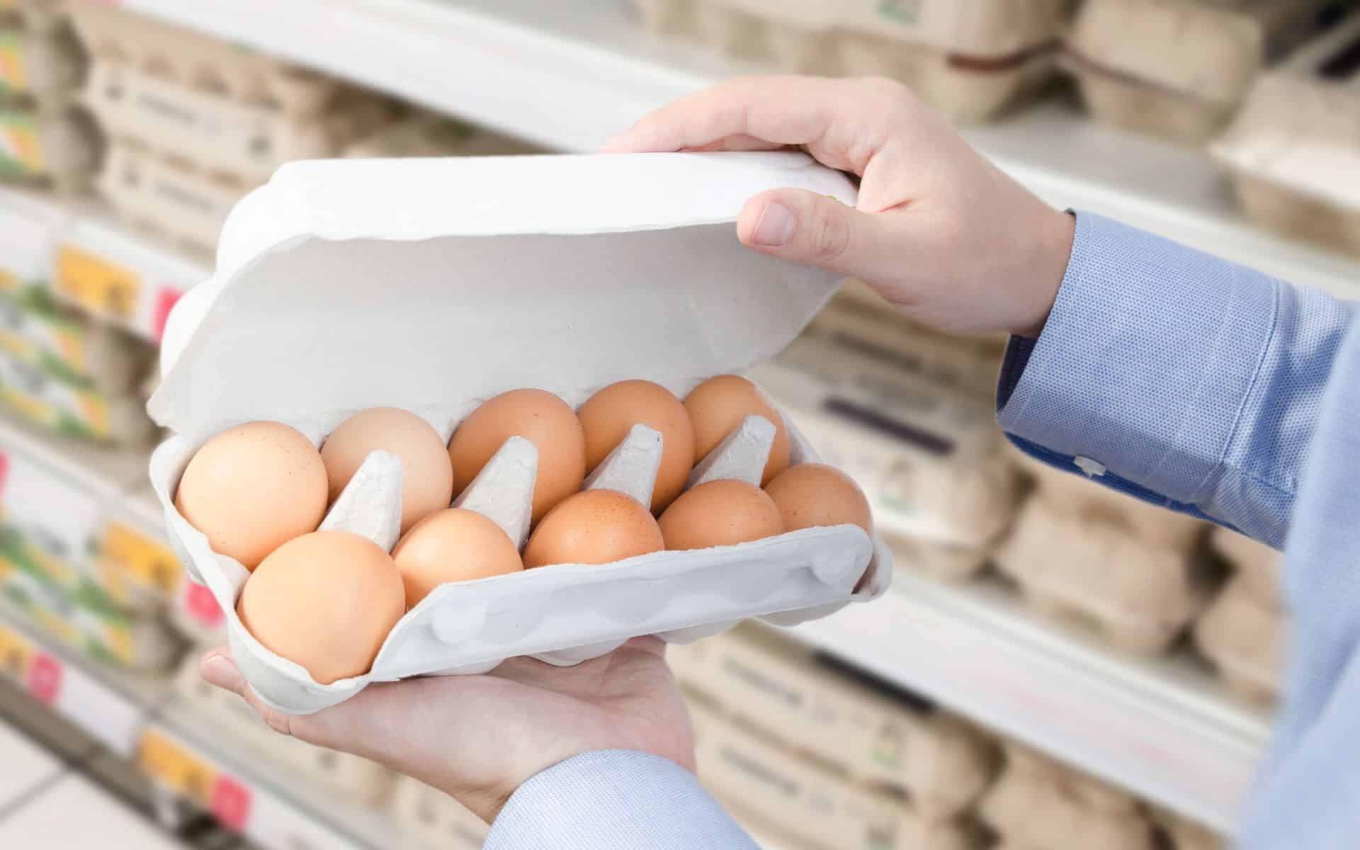 Person Buying Eggs in the Supermarket