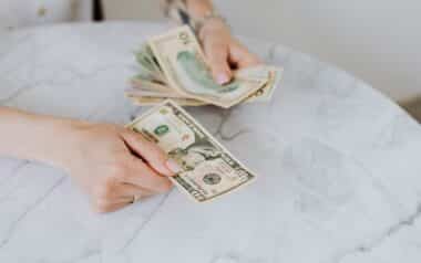 Person Holding US Dollar Bills