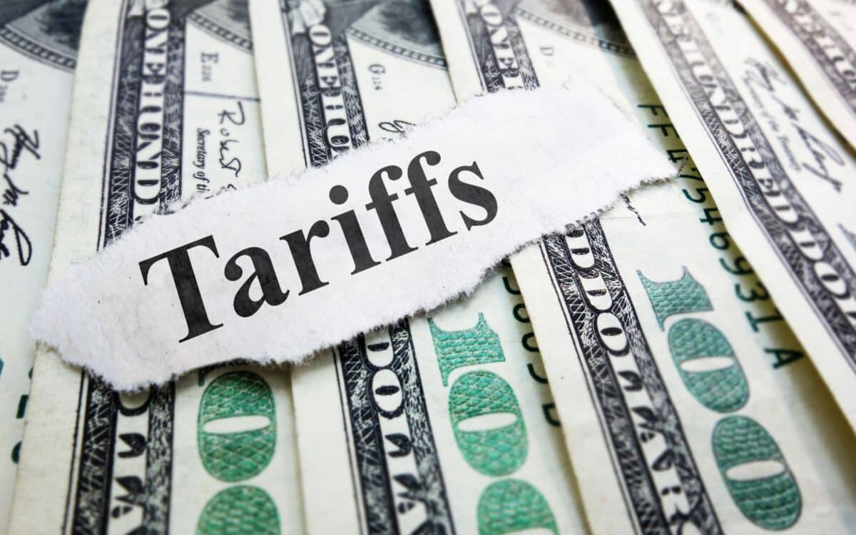 Tariffs newspaper headline on money