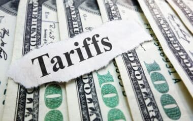 Tariffs newspaper headline on money