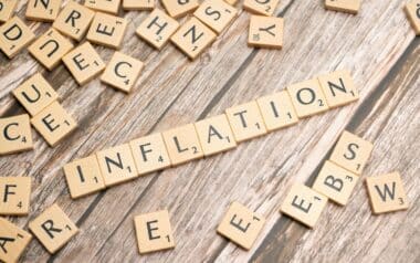 The word inflation is spelled out in scrabble letters