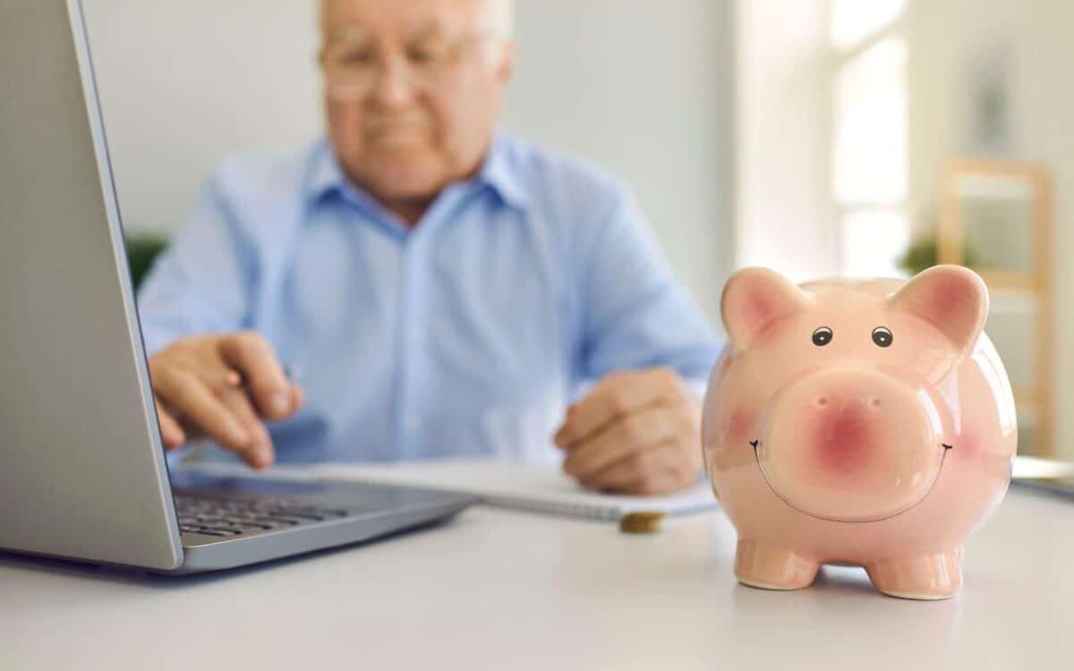Piggy Bank Standing on Desk with Blurred