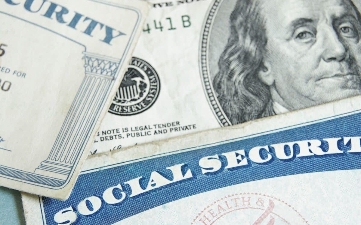 Social Security Cards with Dollar Bills