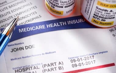 Medicare Health Insurance Card with medicine bottles