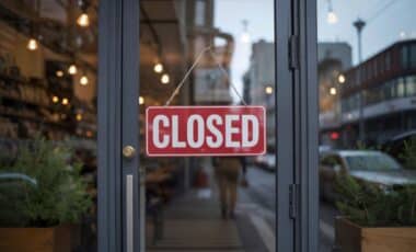 A red and white closed store sign