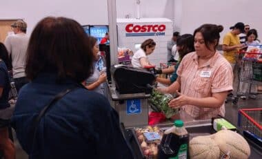 Costco cashier and customer at the checkout line