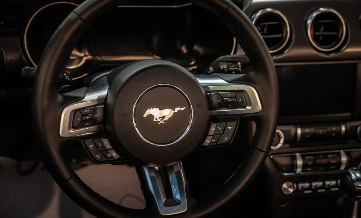 A close-up look at the driver-centric cockpit of the Ford Mustang, where retro design cues meet modern performance technology.