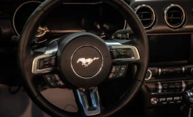 A close-up look at the driver-centric cockpit of the Ford Mustang, where retro design cues meet modern performance technology.
