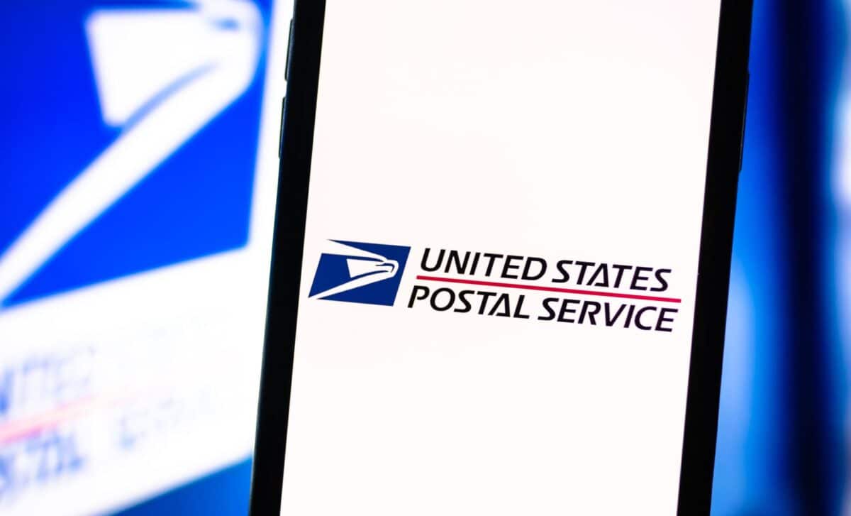 Smartphone with the USPS logo on the screen.