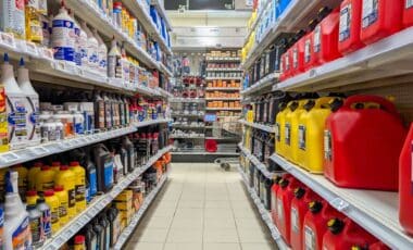 Store shelves filled with colorful fuel containers, oil bottles, and automotive products.