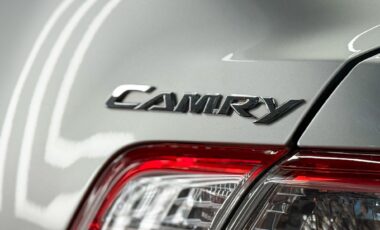 Toyota Camry XV 40 logo on sedan silver car.