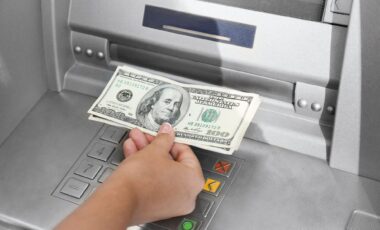 Woman Withdrawing Money From an ATM, Close-Up